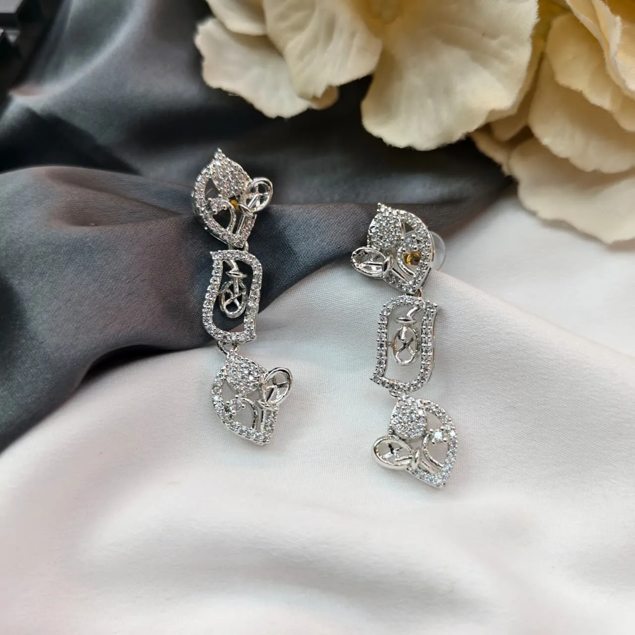 102766.1.1-1.webp AD Fancy Silver Earrings - Image 1