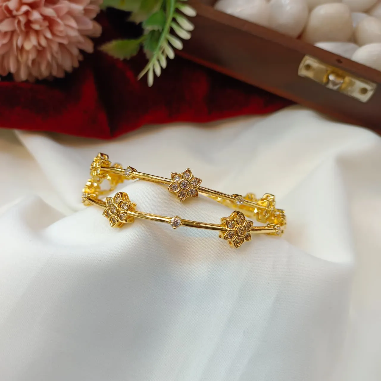104585.1.5 Akshavi Trends Bangles (2) AD Floral Tube Bangles 2s - Image 1